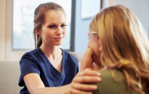 Nurse treating patient suffering with depression